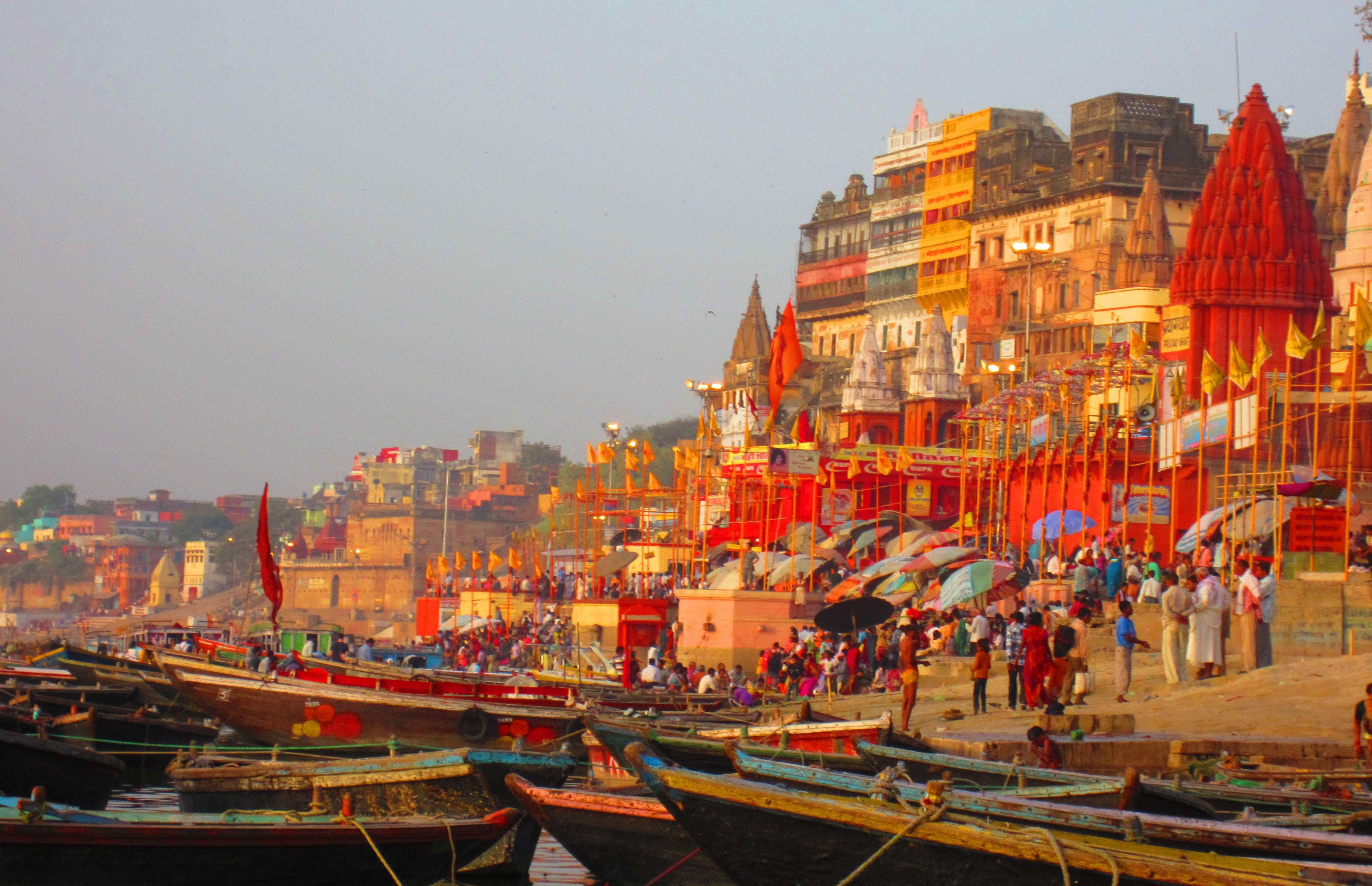 Varanasi ghats at sunrise with boats on the sacred Ganges river